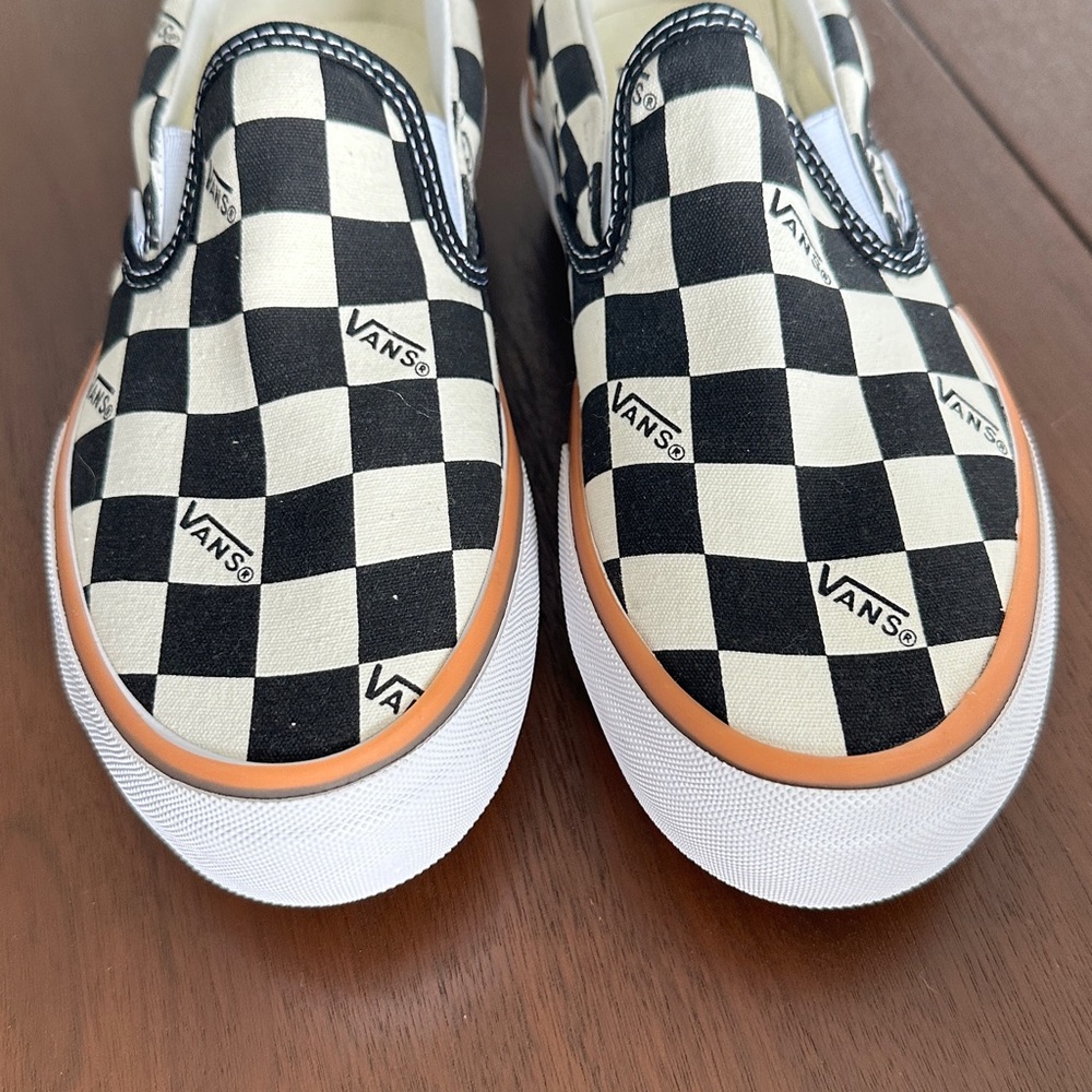 Vans Platform Checkerboard Slip-Ons in Black and White